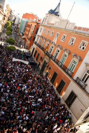 Protesters attend a demonstration against the release on bail of five men known as the "Wolf Pack" cleared of gang rape of a teenager and convicted of a lesser crime of sexual abuse in Madrid, Spain, June 22, 2018. REUTERS/Javier Barbancho