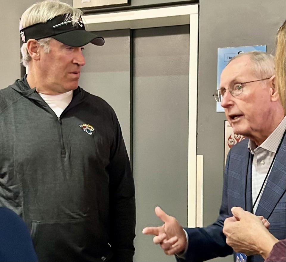 Jacksonville Jaguars coach Doug Pederson (left) talks with Tom Coughlin, the first coach in Jaguars history, during a reception on Nov. 7 at the EverBank Stadium West Club. Coughlin will be inducted into the Florida Sports Hall of Fame on Nov. 8 at the Florida Theater.