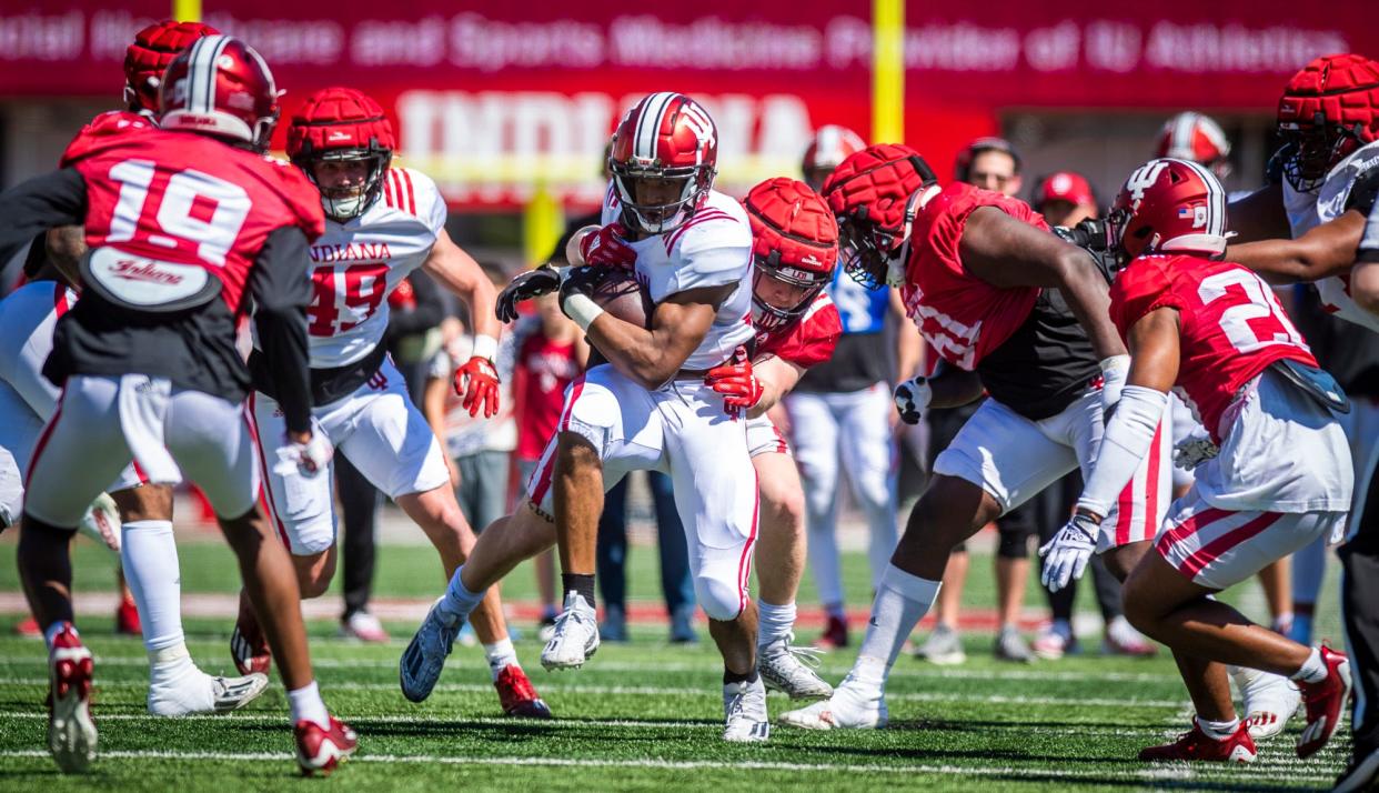 Indiana's David Holloman (33) runs during Indiana football's Spring Football Saturday event at Memorial Stadium on Saturday, April 15, 2203.