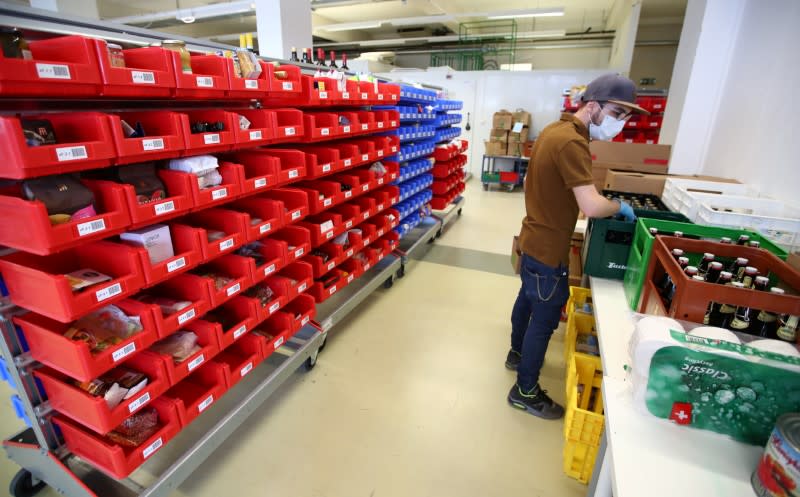 Staff of Farmy.ch, an online shop for home delivery of regional and organic products, prepare customers orders during the coronavirus disease (COVID-19) outbreak