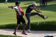 Jun 25, 2017; Cromwell, CT, USA; Jordan Spieth and his caddie Michael Greller react after chipping out of the sand for a birdie during the first playoff hole of the final round of the Travelers Championship golf tournament at TPC River Highlands. Bill Streicher-USA TODAY Sports