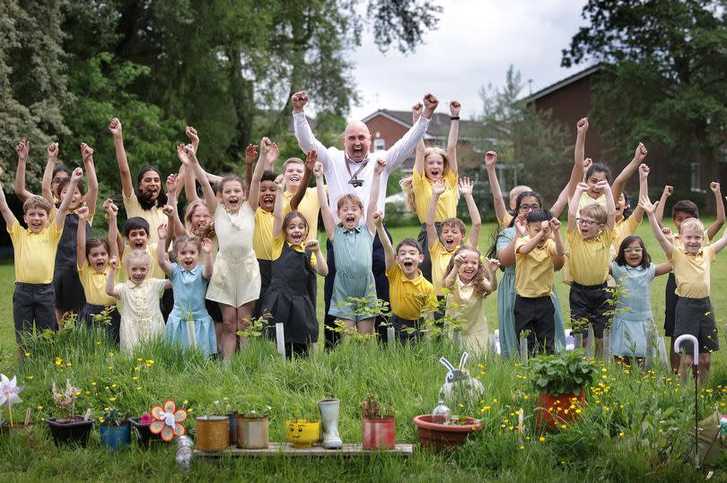 Headteacher Chris Bagnall with pupils at Bradshaw Hall Primary School.