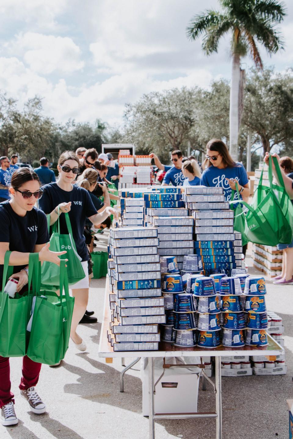 Volunteers pack Thanksgiving meals for distribution through the St. Matthew’s House food pantry.