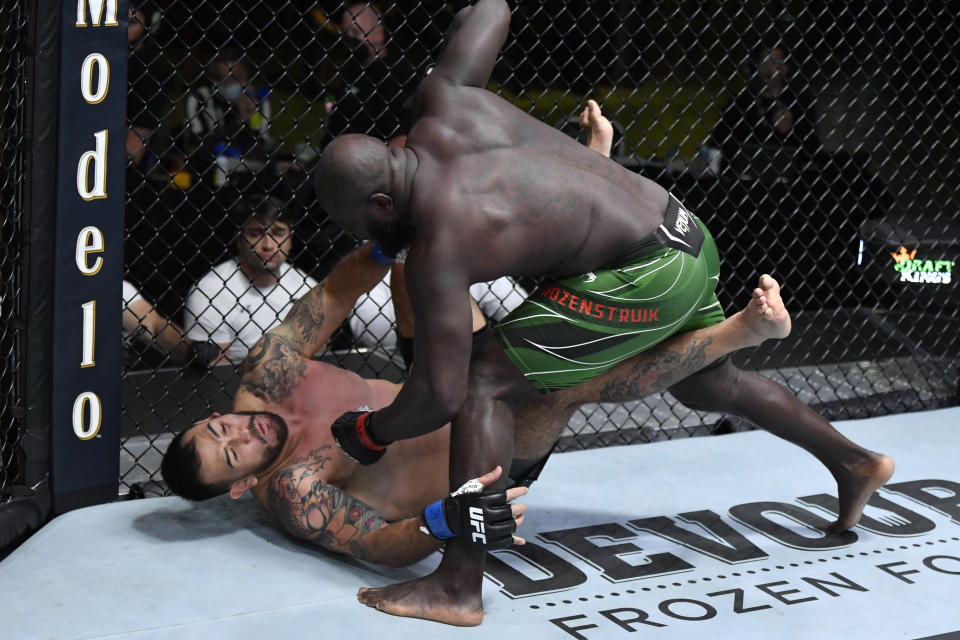 LAS VEGAS, NEVADA - JUNE 05: (R-L) Jairzinho Rozenstruik of Suriname punches Augusto Sakai of Brazil in a heavyweight fight during the UFC Fight Night event at UFC APEX on June 05, 2021 in Las Vegas, Nevada. (Photo by Jeff Bottari/Zuffa LLC)