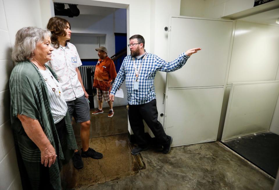 John Cameron, a special education teacher at Pipkin Middle School, showed the elevators to Becky Volz and Trevor Holt, members of the Community Task Force on Facilities.