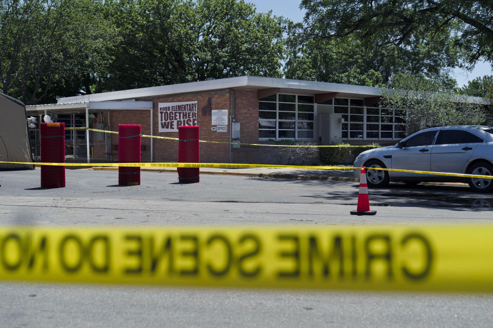 FILE - Crime scene tape surrounds Robb Elementary School after a mass shooting in Uvalde, Texas, May 25, 2022. The Uvalde school shooter gave so many signals that he was violent and unstable that he was nicknamed “school shooter” by teenagers who knew him, according to a Texas lawmakers’ report released Sunday, July 17, 2022. (AP Photo/Jae C. Hong, File)