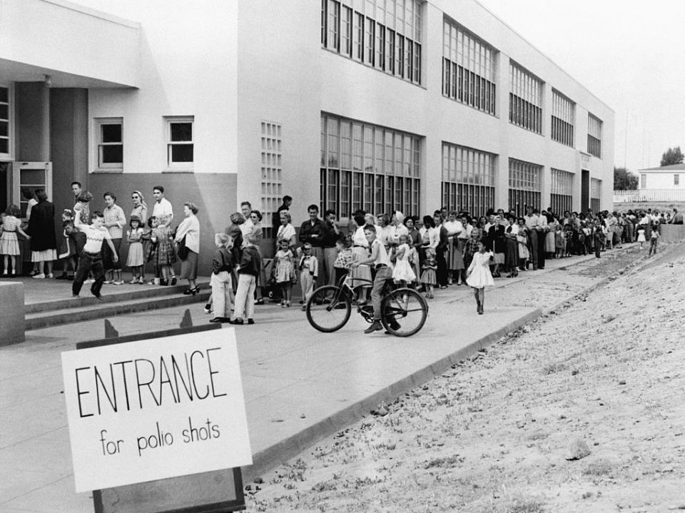 (Original Caption) 4/23/55-San Diego, California: First and second graders at the Kit Carson School here line up for Salk Polio vaccine shots April 16th. San Diego was the first community in the United States to start this Spring’s mass inoculation with the serum. (Getty Images)