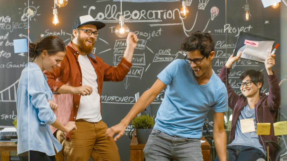 Happy Young People Dancing in the Office. Creative People Have Fun.