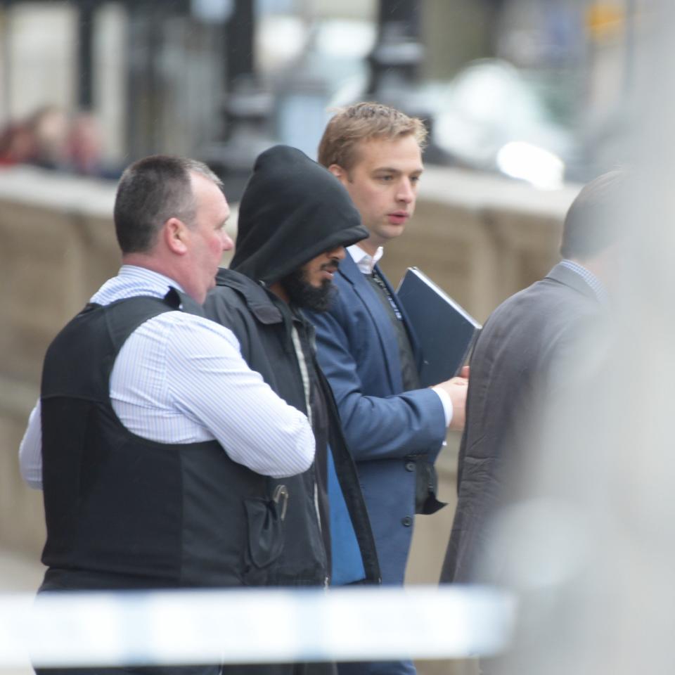 Officers lead a suspect away - Credit: Geoff Pugh