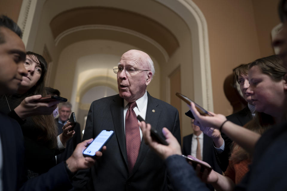 Senate Appropriations Committee Chair Patrick Leahy, D-Vt., is surrounded by reporters at the Capitol seeking updates on negotiations on the government spending package, at the Capitol in Washington, Monday, Dec. 19, 2022. (AP Photo/J. Scott Applewhite)