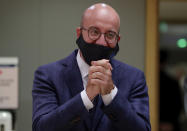 European Council President Charles Michel clasps his hands during a round table meeting at an EU summit in Brussels, Tuesday, July 21, 2020. Weary European Union leaders finally clinched an unprecedented budget and coronavirus recovery fund early Tuesday, finding unity after four days and as many nights of fighting and wrangling over money and power in one of their longest summits ever. (Stephanie Lecocq, Pool Photo via AP)