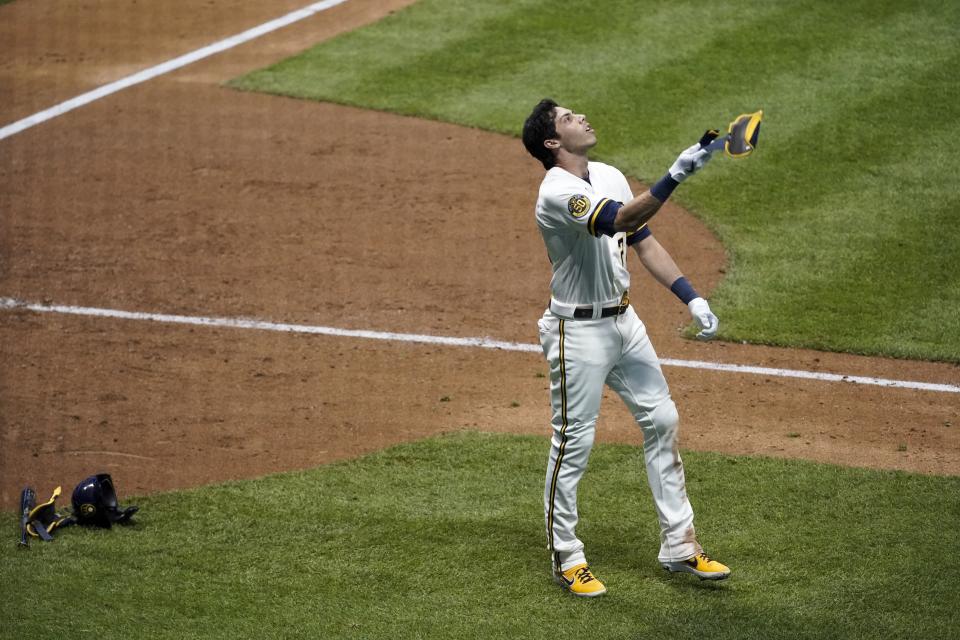 Milwaukee Brewers' Christian Yelich reacts after striking out during the eighth inning of a baseball game against the Chicago White Sox Tuesday, Aug. 4, 2020, in Milwaukee. (AP Photo/Morry Gash)