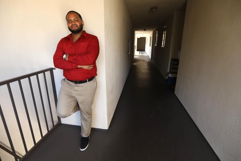 LOS ANGELES, CA - OCTOBER 18, 2022 - - Robert Gardner, a Section 8, tenant who was denied numerous times by landlords who said they didn't take Section 8, stands in the apartment building where he currently lives in Los Angeles on October 18, 2022. It took Gardner months until he finally found a landlord who would agree to take his Section 8 voucher. Two years ago, the city and state passed laws that barred landlords from refusing to take Section 8 residents. But tenants and activists say this continues. (Genaro Molina / Los Angeles Times)