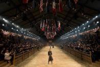 <p>Welcome to Dallas, Texas for the Chanel Metiers D'Art show. There's rodeos and then there are Chanel rodeos: flags bearing the red, white and blue, models decked out in cowboy hats and boots and a finale stampede that could have passed as the Pamplona. </p>