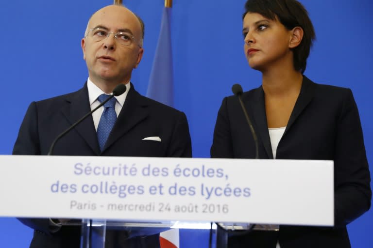 French Interior Minister Bernard Cazeneuve (L), flanked by French Education minister Najat Vallaud-Belkacem, talks during a press conference about the upcoming security measures around schools in Paris, on August 24, 2016