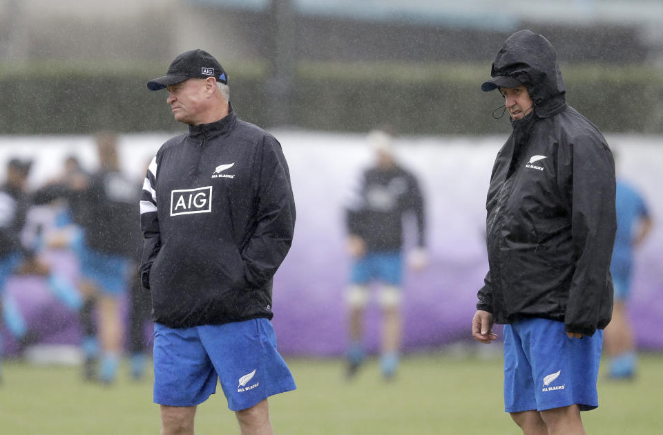 All Blacks selector Grant Fox, left, and assistant coach Ian Foster watch their players during a training session in Tokyo, Japan, Tuesday, Oct. 22, 2019. The All Blacks play England in a Rugby World Cup semifinal in Yokohama on Saturday Oct. 26. (AP Photo/Mark Baker)