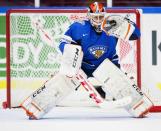 Finland's goalkeeper Juuse Saross catches the puck during their preliminary round match against Norway, at the International Ice Hockey Federation (IIHF) World Junior Hockey Championships in Malmo December 27, 2013. REUTERS/Tadegnon Kokou Noel/TT News Agency (SWEDEN - Tags: SPORT ICE HOCKEY) ATTENTION EDITORS - THIS IMAGE WAS PROVIDED BY A THIRD PARTY. FOR EDITORIAL USE ONLY. NOT FOR SALE FOR MARKETING OR ADVERTISING CAMPAIGNS. SWEDEN OUT. NO COMMERCIAL OR EDITORIAL SALES IN SWEDEN. THIS PICTURE IS DISTRIBUTED EXACTLY AS RECEIVED BY REUTERS, AS A SERVICE TO CLIENTS