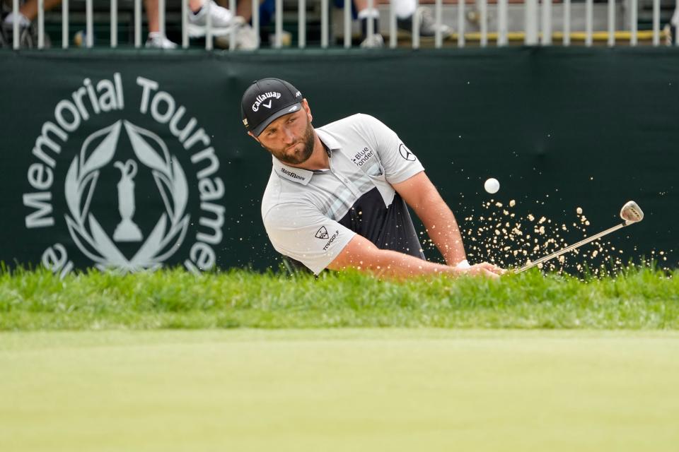 Jon Rahm hits onto the 8th green during the first round of last year's Memorial.