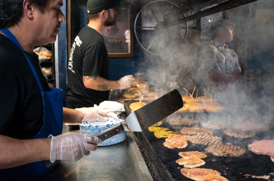 Ralph Nino (left) works the grill at The Chuckbox on March 26, 2024, at 202 E. University Dr., in Tempe.