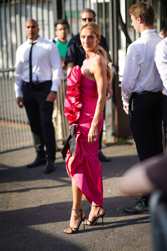 Celine Dion wears a pink ruffled dress, a necklace, earrings, outside Miu Miu Club 2020,  on June 29, 2019 in Paris, France. [Photo: Getty]