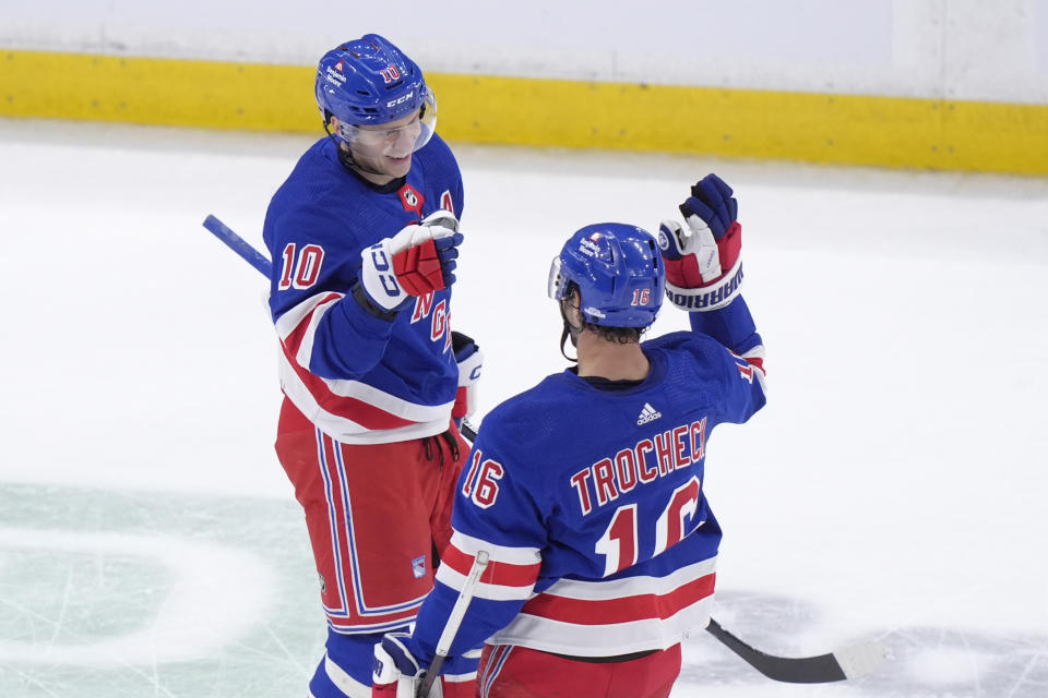 New York Rangers left wing Artemi Panarin (10) celebrates with center Vincent Trocheck (16) after scoring in the third period of an NHL hockey game against the Boston Bruins, Thursday, March 21, 2024, in Boston. (AP Photo/Steven Senne)