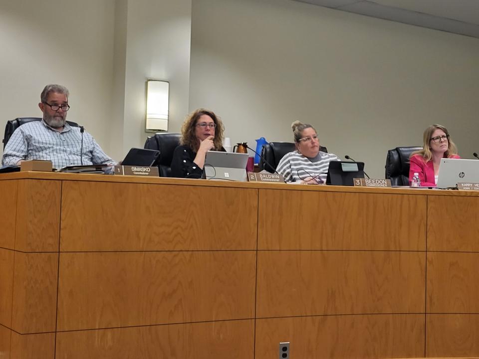 St. Clair County Commissioners Steve Simasko, from left, Jorja Baldwin, and Lisa Beedon, and County Administrator Karry Hepting listen to public comment on Thursday, March 2, 2023, during the county board's meeting.