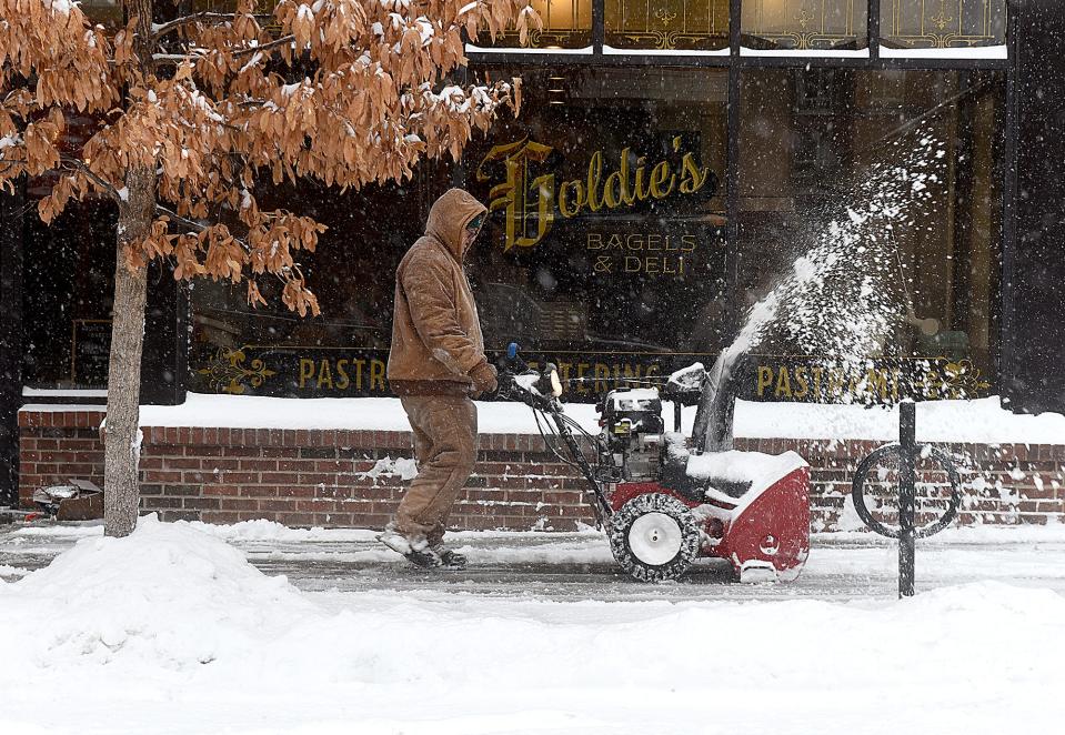 Steve Davis of Atkins Inc. removes snow from the sidewalk in front of Goldie’s Bagel & Deli at 114 S. Ninth St., Suite 102 on Wednesday.