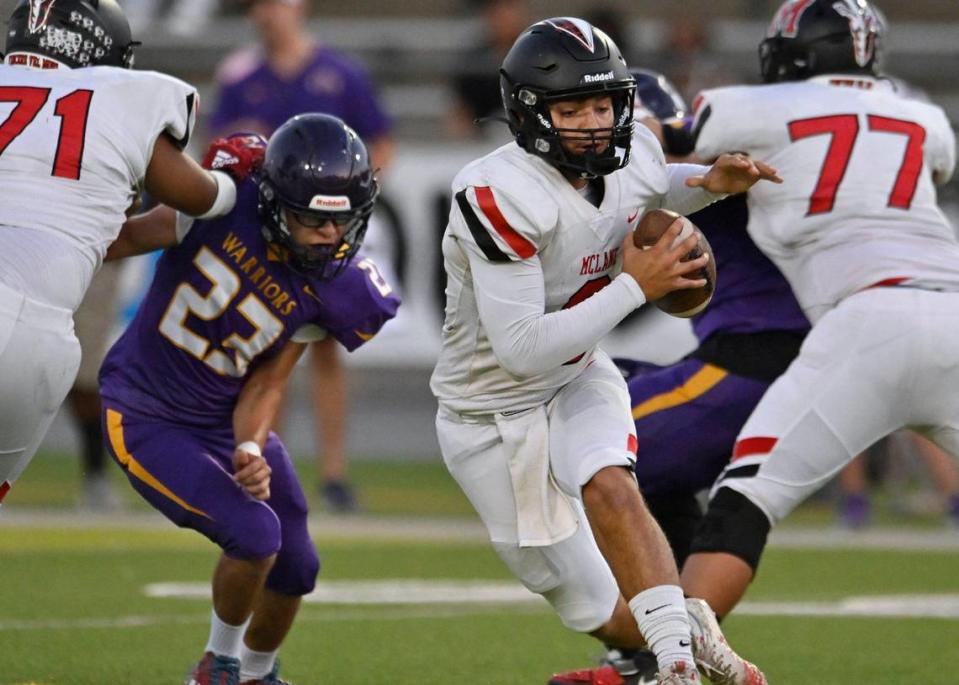 McLane quarterback Noah Zamora, center, scrambles through a hole in Fresno’s defense Thursday, Sept. 14, 2023 in Fresno.