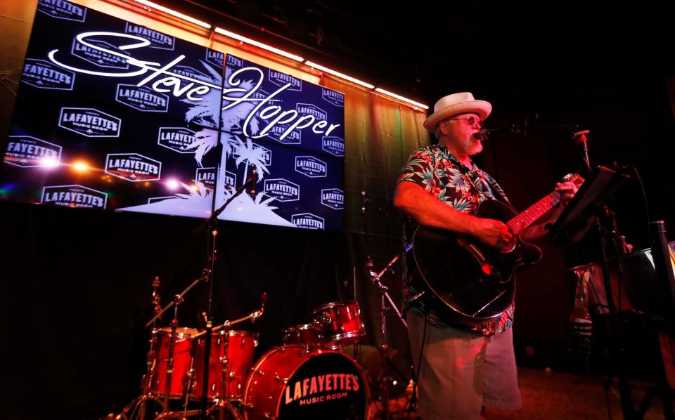 Trop Rock musician and tribute artist Steve Hopper, also a member of The Parrot Head Club of Memphis, can be seen preparing to sing Jimmy Buffett tribute songs at a gathering to honor Jimmy Buffett at Lafayette's Music Room in Memphis, Tenn., on Sept. 4, 2023.