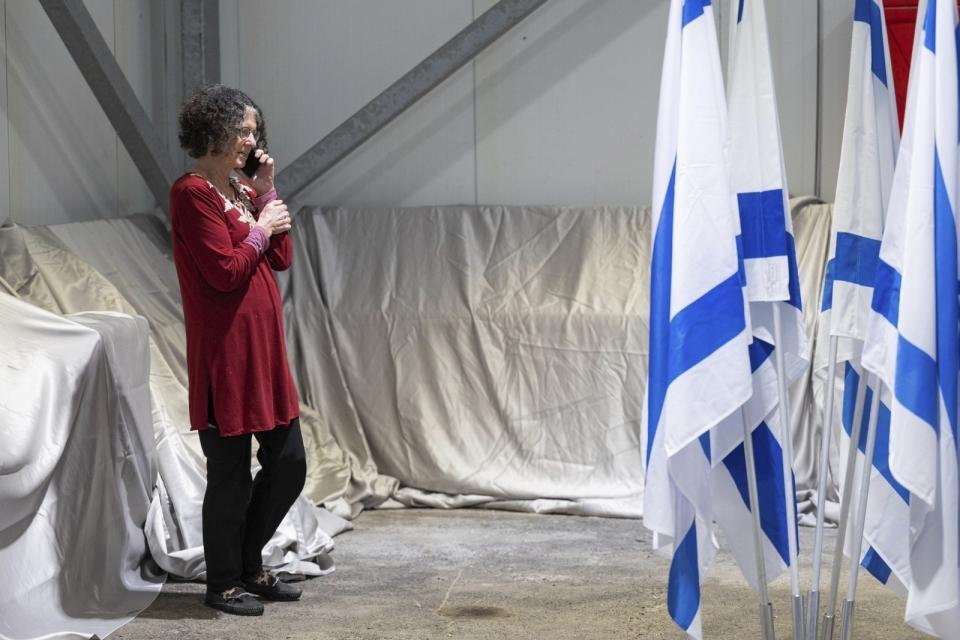 FILE - This handout photo provided by the Israel Prime Minister Office shows Shoshan Haran speaking on the phone upon her arrival in Israel after being freed. Shoshan was one of the 13 Israeli hostages that Hamas released late Saturday, Nov. 25, 2023, in the second round of swaps under a cease-fire deal. Step by step, the newly freed and their families are testing the ground for a path to recovery. No one, including the physicians and psychologists who have been treating them, is sure how to get there or how long it might take. (Israel Prime Minister Office/Handout via AP, File)