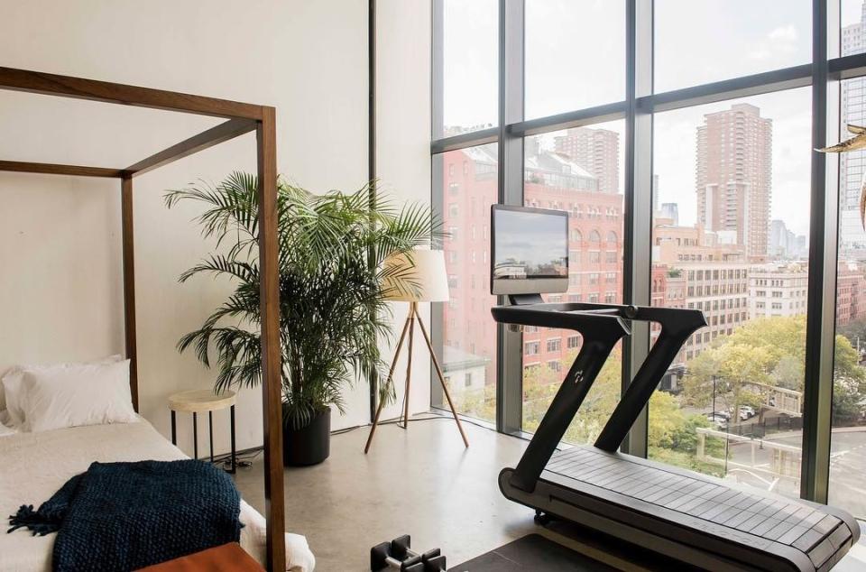 A Peloton Tread device in a bedroom.