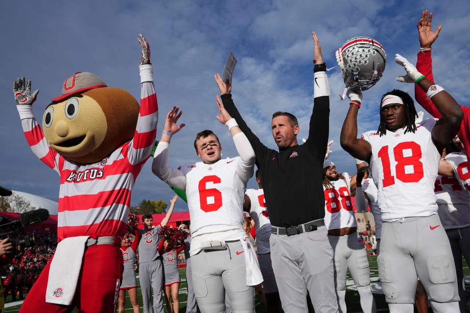 Nov 4, 2023; Piscataway, New Jersey, USA; Ohio State Buckeyes quarterback Kyle McCord (6), offensive coordinator Brian Hartline and wide receiver Marvin Harrison Jr. (18) sing “Carmen Ohio” following the NCAA football game against the Rutgers Scarlet Knights at SHI Stadium. Ohio State won 35-16.
