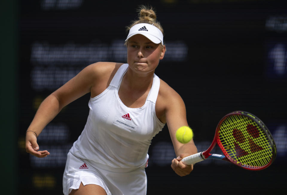 Germany's Nastasja Mariana Schunk returns a shot to Spain's Ane Mintegi Del Olmo, in the girls' singles final match on No.1 Court of the Wimbledon Tennis Championships in London, Sunday, July 11, 2021. (Jon Super/Pool Photo via AP)