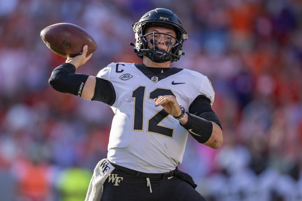 Wake Forest quarterback Mitch Griffis (12) passes the ball against Clemson during the second half of an NCAA college football game Saturday, Oct. 7, 2023, in Clemson, S.C. (AP Photo/Jacob Kupferman)