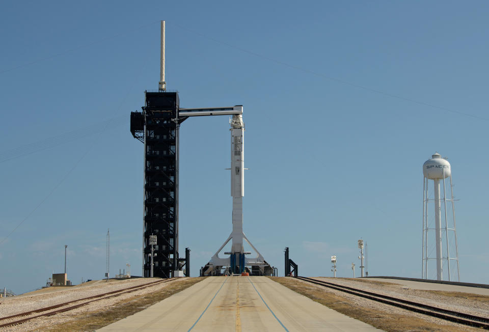 A SpaceX Falcon 9 rocket with the company's Crew Dragon spacecraft onboard is raised into a vertical position on the launch pad at Launch Complex 39A as preparations continue for the Demo-2 mission on May 21, 2020, at NASA's Kennedy Space Center in Florida. (Bill Ingalls / NASA)