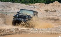 <p>What else do you do with a new Jeep Wrangler besides getting it very, very dirty? Here, <a rel="nofollow noopener" href="https://www.caranddriver.com/reviews/2018-jeep-wrangler-rubicon-unlimited-v-6-manual-test-review" target="_blank" data-ylk="slk:the stick-shift, V-6–powered four-door Wrangler Rubicon;elm:context_link;itc:0;sec:content-canvas" class="link ">the stick-shift, V-6–powered four-door Wrangler Rubicon</a> splashes around in our local rock quarry. </p>