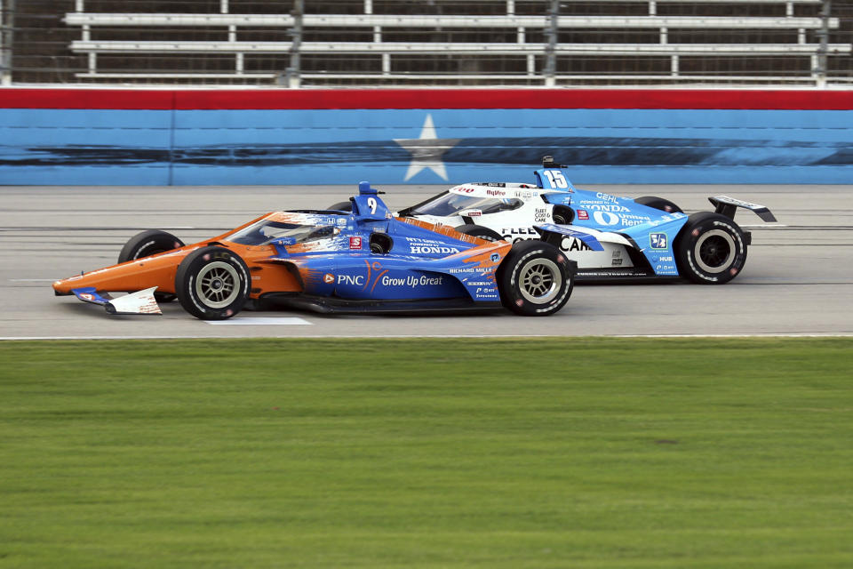 Scott Dixon tries to hold off Graham Rahal down the front stretch during an IndyCar Series auto race at Texas Motor Speedway on Sunday, May 2, 2021, in Fort Worth, Texas. (AP Photo/Richard W. Rodriguez)