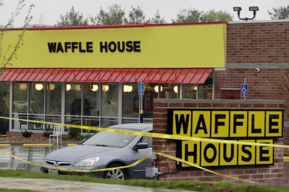 Four people were killed after a gunman opened fire at a Waffle House restaurant on Sunday (AP)