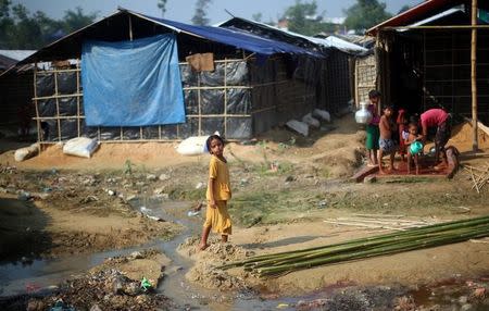 A Rohingya refugee girl plays outside her shelter in Balukhali refugee camp near Cox's Bazar, Bangladesh, October 26, 2017. REUTERS/Hannah McKay
