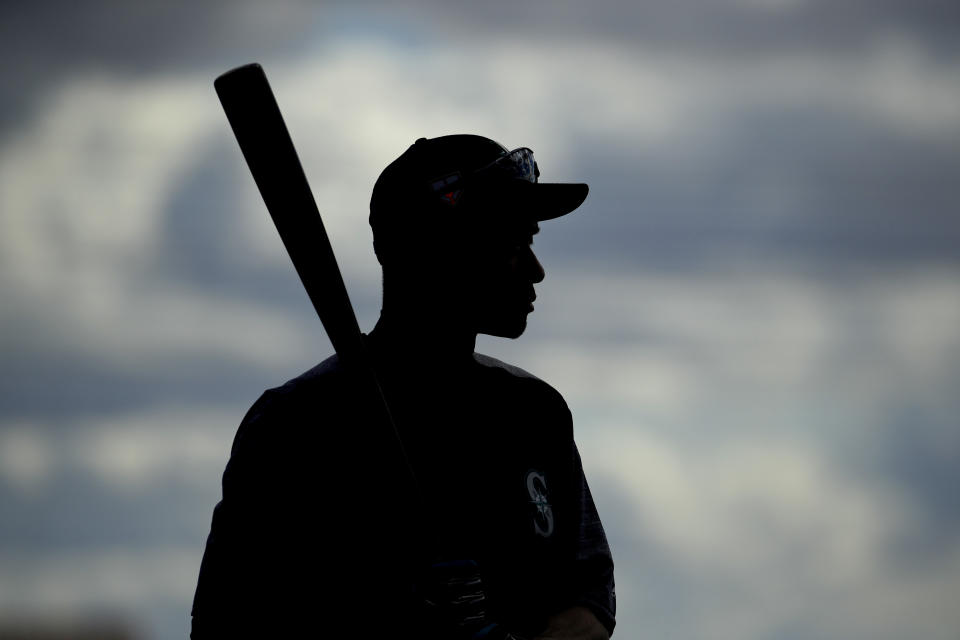 Seattle Mariners' Ichiro Suzuki waits to take batting practice during spring training baseball practice Saturday, Feb. 16, 2019, in Peoria, Ariz. (AP Photo/Charlie Riedel)