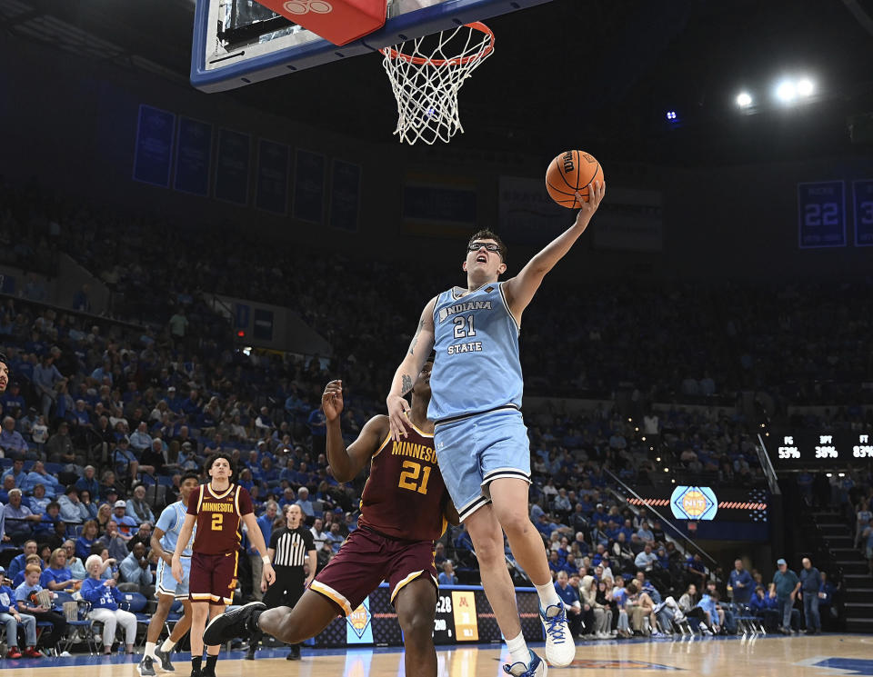 Indiana State's Robbie Avila, right, drives to the basket and scores against Minnesota during a second-round NCAA college basketball game in the NIT Tournament on Sunday, March 24, 2024, in Terre Haute, Ind. (Joseph C. Garza/The Tribune-Star via AP)