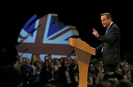 Britain's Prime Minister David Cameron delivers his keynote address to the Conservative Party annual conference in Manchester, northern England October 2, 2013. REUTERS/Phil Noble