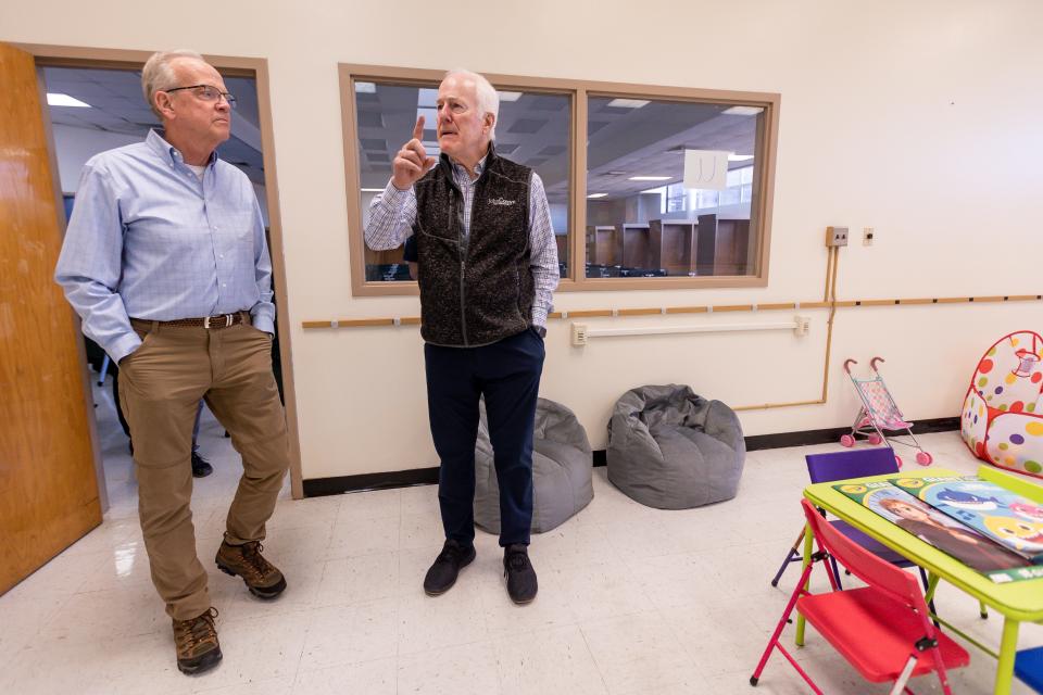 U.S. Sens. Jerry Moran, R-Kansas, and John Cornyn, R-Texas, tour rooms that have temporary migrant care accommodations and services at the Emergency Migrant Operations Facility located in the shuttered Bassett Middle School in El Paso on Monday.