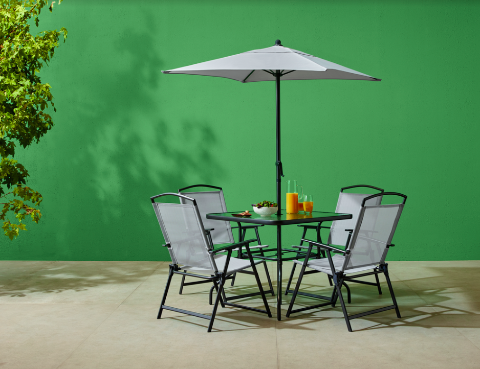 <p>Value for money is second-to-none where this sleek dining set is concerned. It includes four adjustable chairs, a glass-topped table, and a parasol too – perfect for summer soirées and picky bits in the back garden.</p><p>The subtle grey colourway means it'll be in style for years to come, too.</p><p><a class="link " href="https://www.tesco.com/store-locator/" rel="nofollow noopener" target="_blank" data-ylk="slk:FIND YOUR NEAREST TESCO;elm:context_link;itc:0;sec:content-canvas">FIND YOUR NEAREST TESCO</a></p>