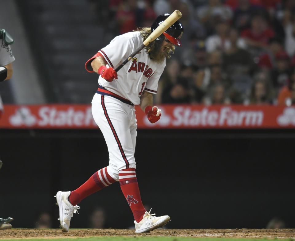 Los Angeles Angels' Brandon Marsh react to striking out with two runners on base in the sixth inning of the team's baseball game against the Oakland Athletics on Friday, July 30, 2021, in Anaheim, Calif. (AP Photo/John McCoy)