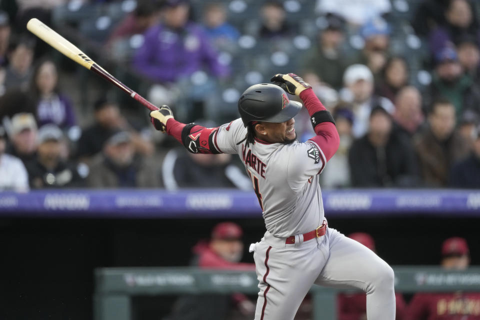 Arizona Diamondbacks' Ketel Marte watches his solo home run off Colorado Rockies starting pitcher Kyle Freeland during the third inning of a baseball game Friday, April 28, 2023, in Denver. (AP Photo/David Zalubowski)