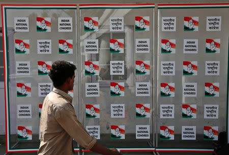 FILE PHOTO: A man walks past the headquarters of India's Congress party in New Delhi May 16, 2014. REUTERS/Adnan Abidi/File Photo