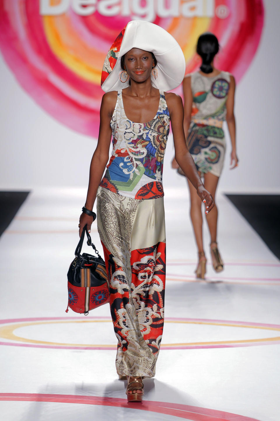 In this Thursday, Sept. 6, 2013, photo, fashion from the Desigual Spring 2014 collection is modeled during Fashion Week in New York. (AP Photo/Desigual)