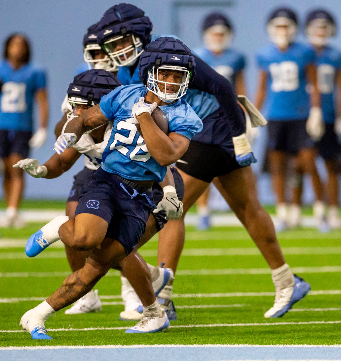 North Carolina running back Omarion Hampton (28) carries the ball during the Tar Heels’ first practice of the season on Monday, July 29, 2024 in Chapel Hill, N.C.