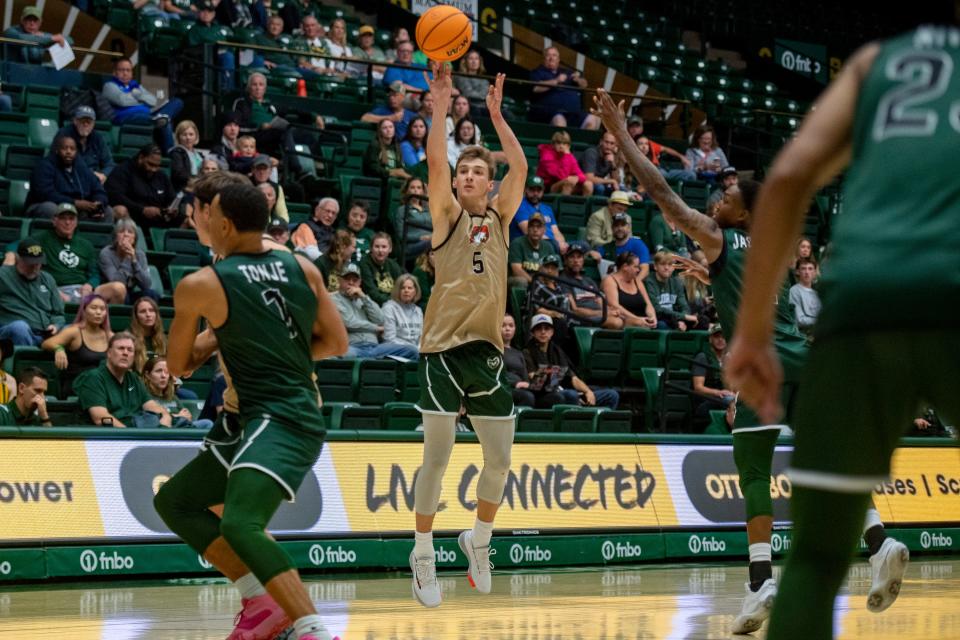 CSU's Baylor Hebb lines up a three-pointer during the CSU men's basketball Homecoming scrimmage in Moby Arena on Saturday, Oct. 15, 2022, in Fort Collins, Colo.